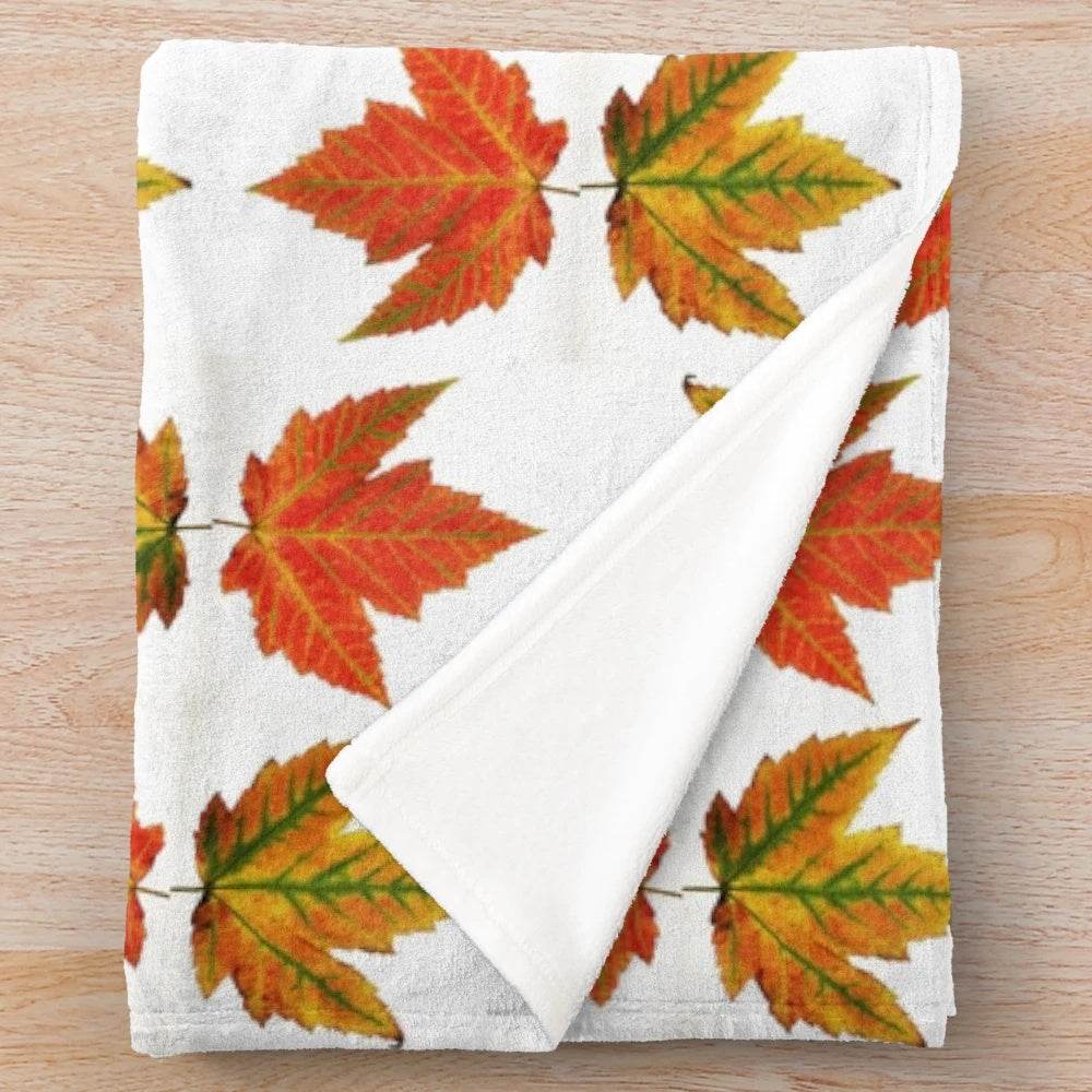 Autumn leaves plush blanket featuring a vibrant orange and red fall foliage design