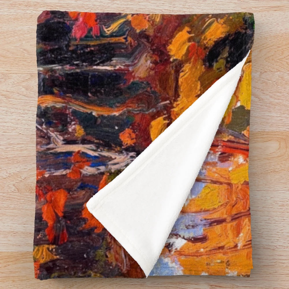 Plush blanket featuring the vibrant autumn woods artwork of Canadian painter Tom Thomson