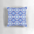 Decorative pillow featuring a watercolor painting of a traditional Portuguese azulejo tile pattern in blue and yellow.
