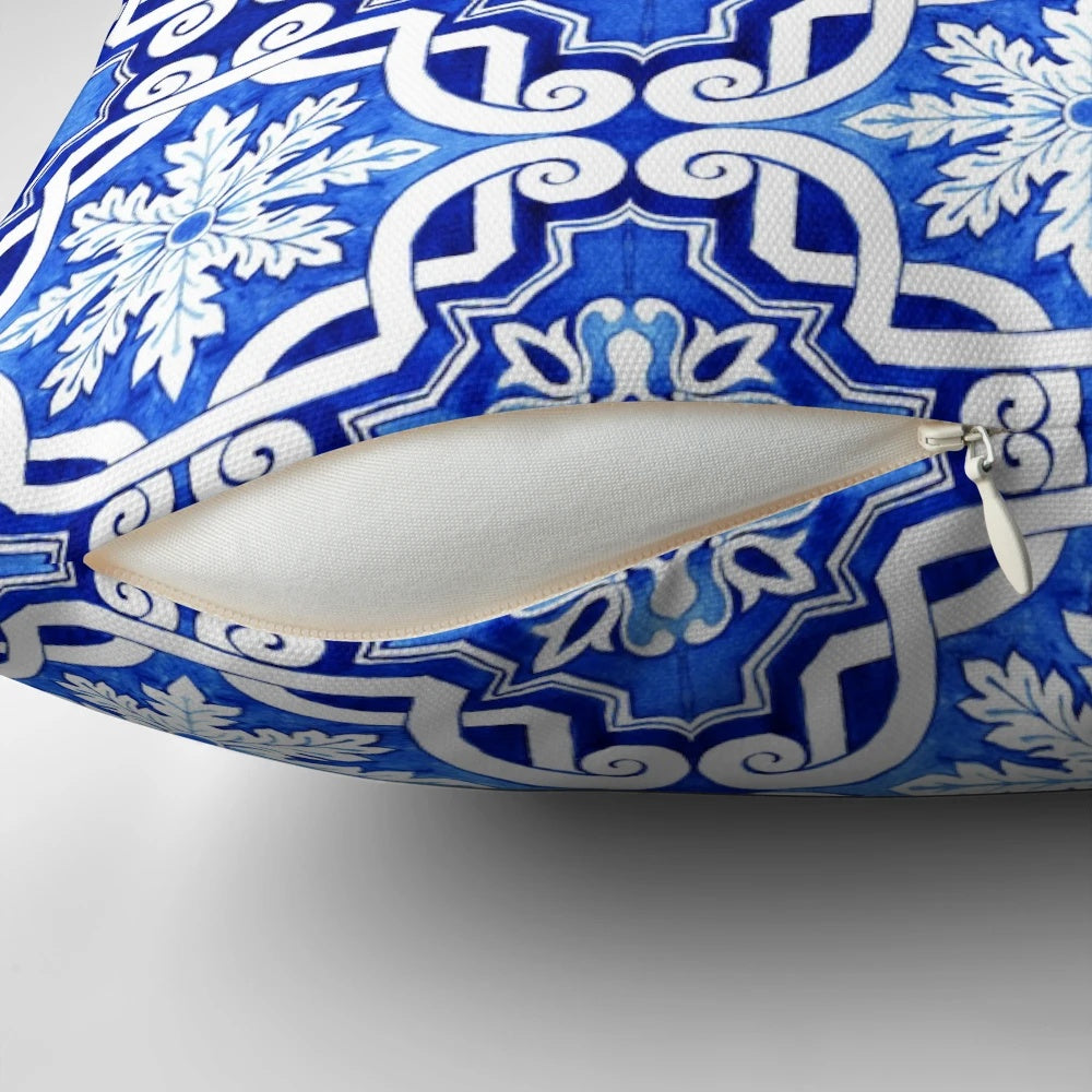 Decorative pillow featuring a watercolor painting of a traditional Portuguese azulejo tile pattern in blue and yellow.