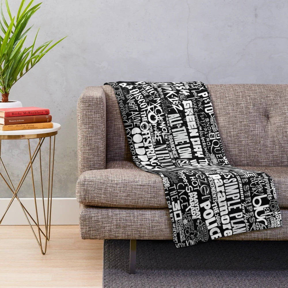 Cozy plush blanket featuring a vibrant collage of popular band imagery and lyrics