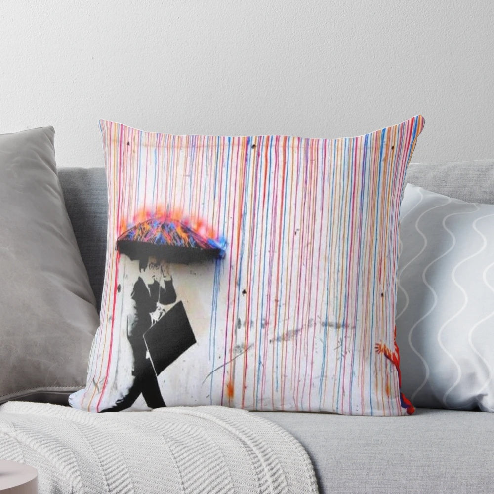 Colorful Banksy-inspired pillow design featuring a woman walking in the rain under a vibrant rainbow