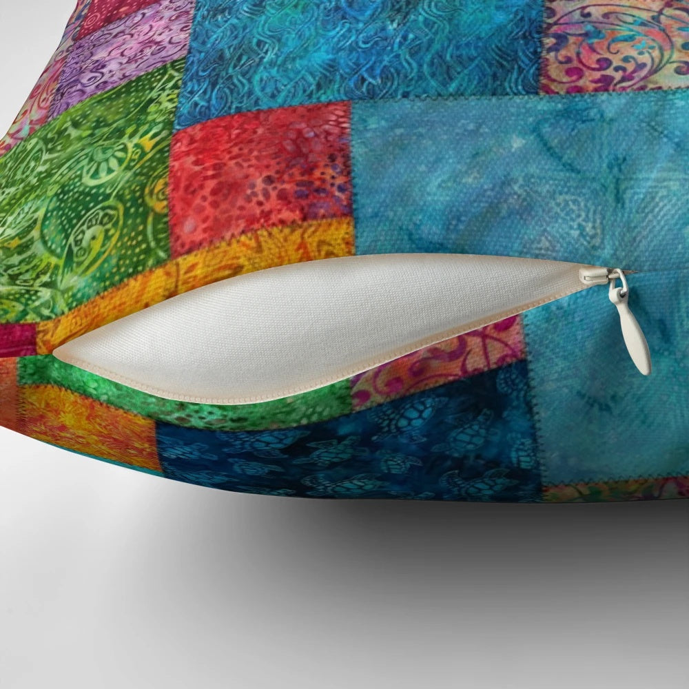 Colorful batik patchwork quilted pillow with bohemian, boho, and hippie design elements.