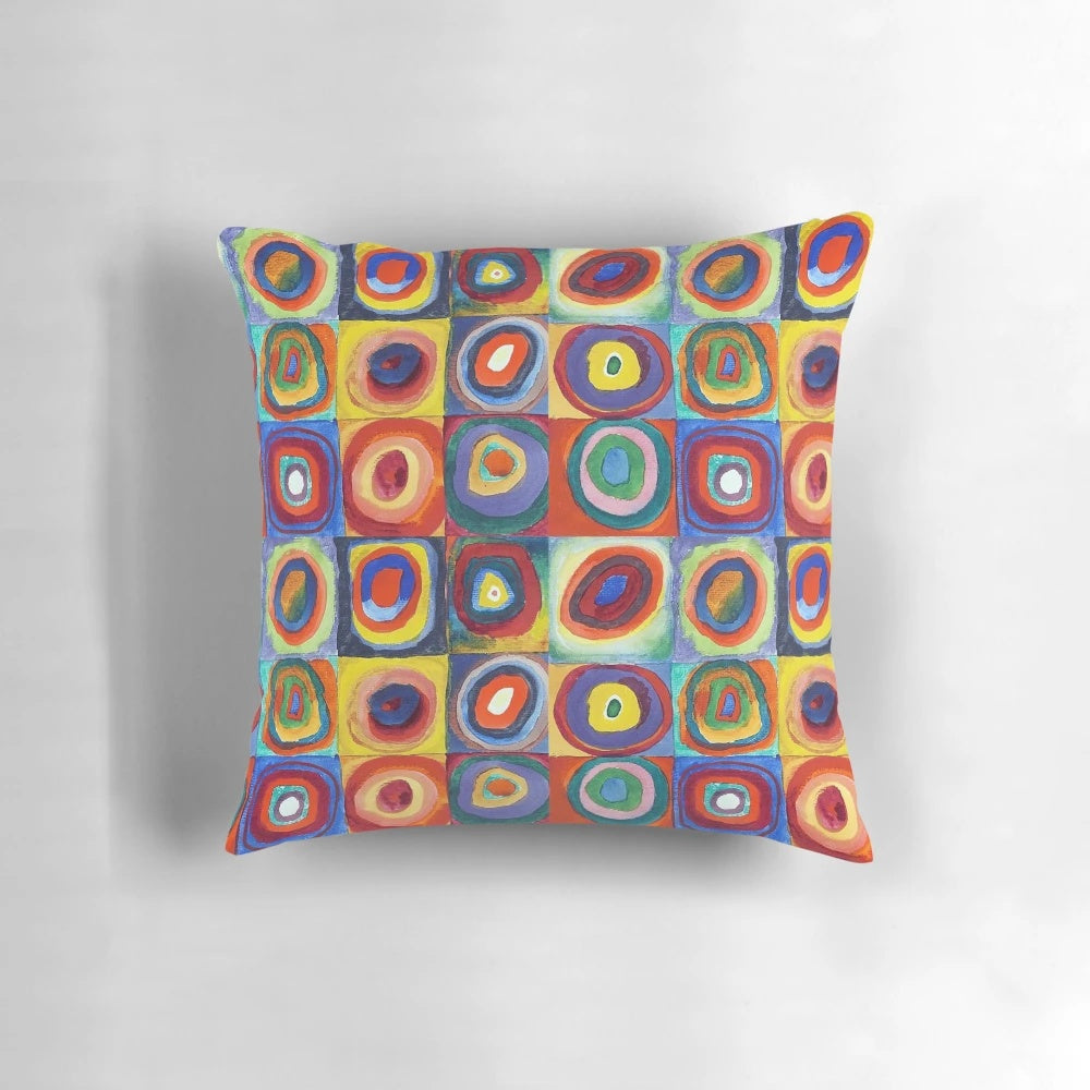 Colorful abstract art pillow featuring Wassily Kandinsky's "Color Study, Squares with Concentric Circles" design