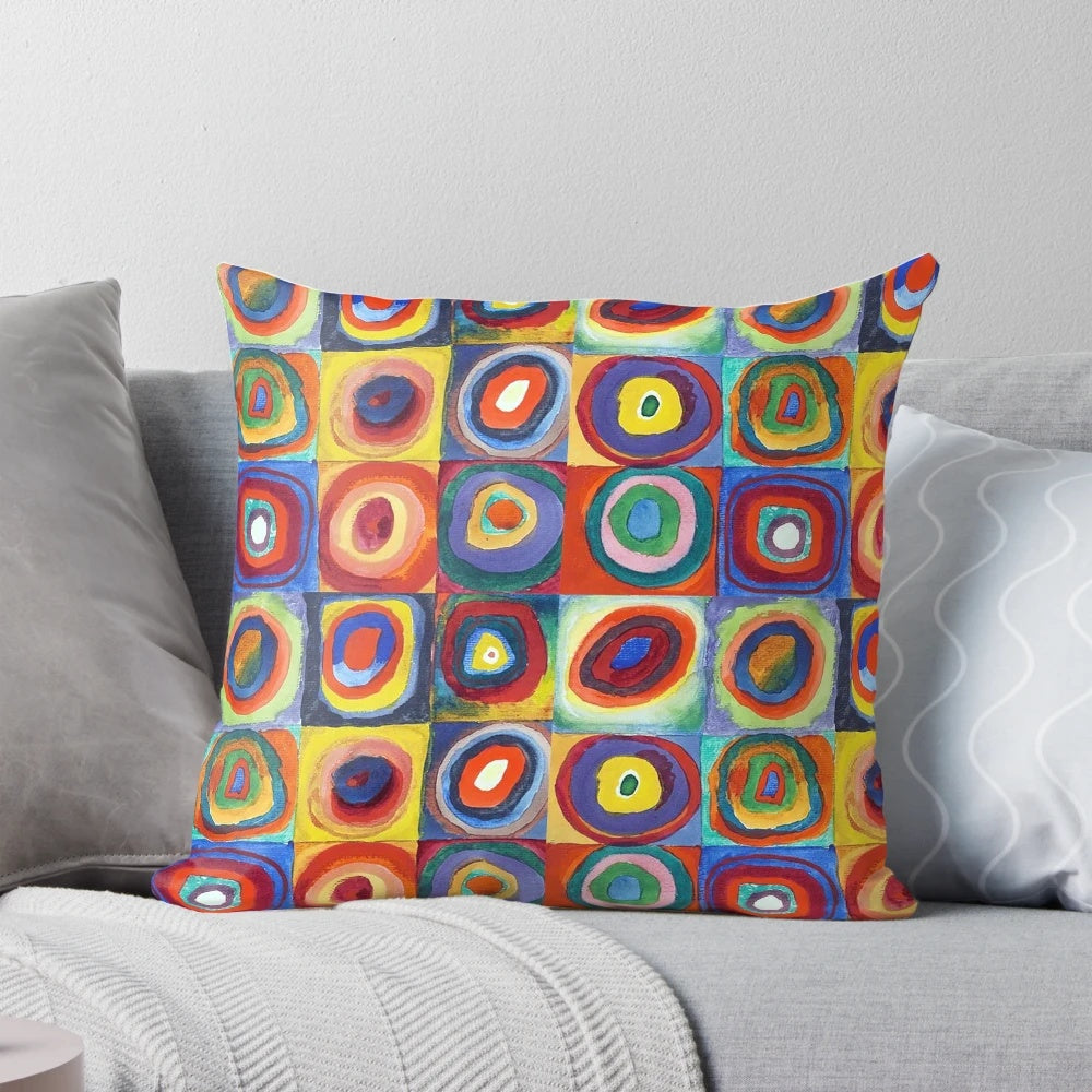 Colorful abstract art pillow featuring Wassily Kandinsky's "Color Study, Squares with Concentric Circles" design