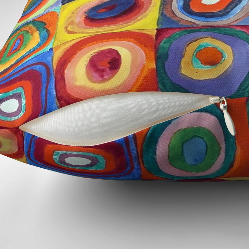 Colorful abstract art pillow featuring Wassily Kandinsky's "Color Study, Squares with Concentric Circles" design
