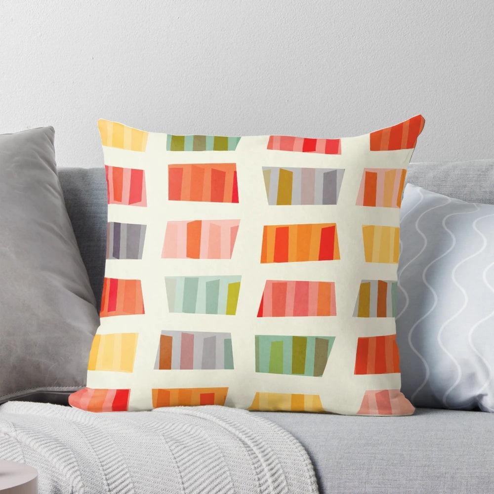 Colorful and abstract beach towel pattern printed on a soft pillow for a cozy vacation vibe