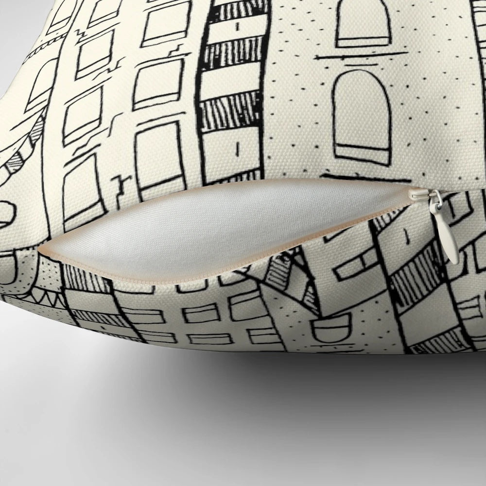 Colorful abstract throw pillow with a design featuring a big yellow sun over a small city skyline.