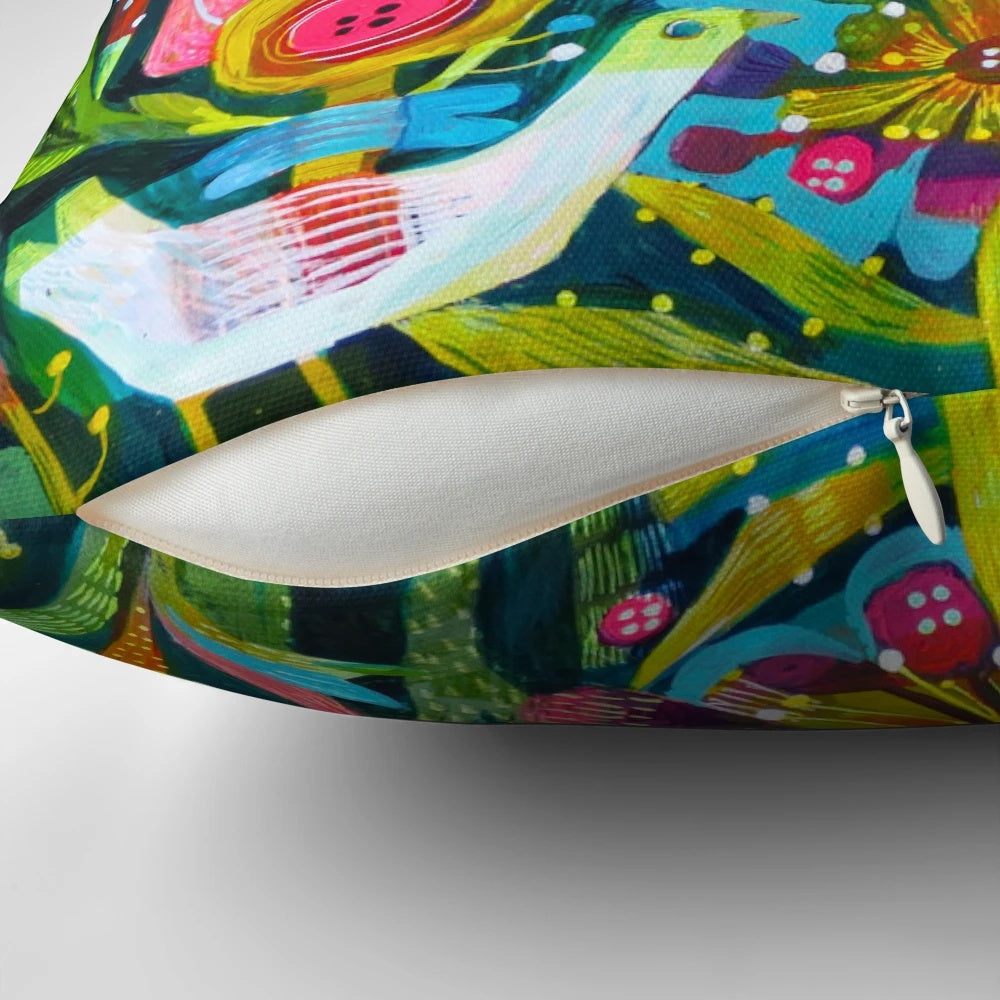 Colorful throw pillow with a vibrant design featuring birds, flowers, and a garden-inspired pattern.