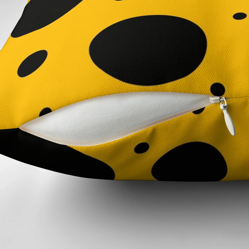Stylish black and yellow polka dot pattern on a modern, minimalist throw pillow