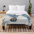 Soft and cozy plush blanket featuring a pair of black cockatoos perched on a branch with a rainbow gradient background