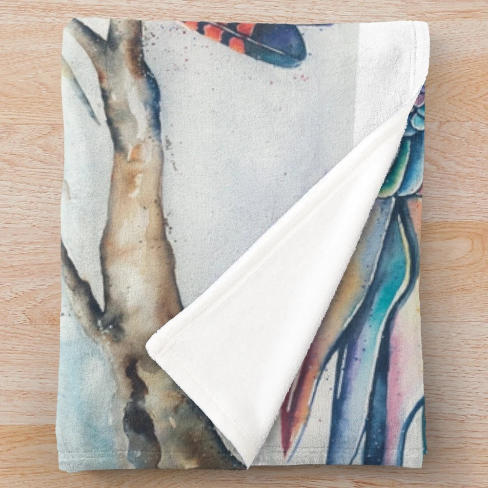 Soft and cozy plush blanket featuring a pair of black cockatoos perched on a branch with a rainbow gradient background