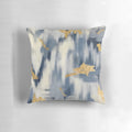 Stunning blue and gold ikat-inspired abstract design on decorative throw pillow