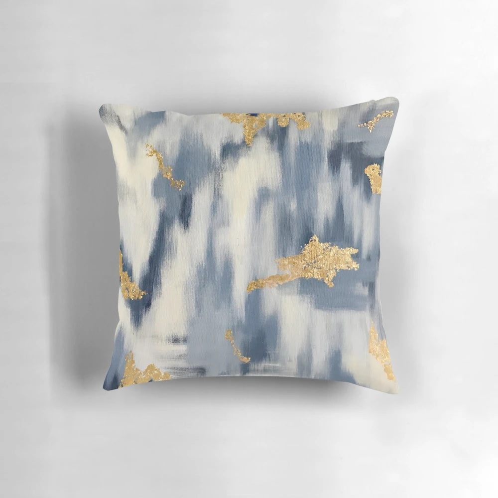 Stunning blue and gold ikat-inspired abstract design on decorative throw pillow