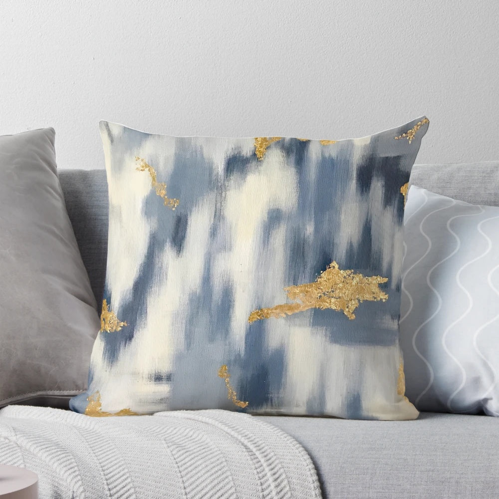 Stunning blue and gold ikat-inspired abstract design on decorative throw pillow
