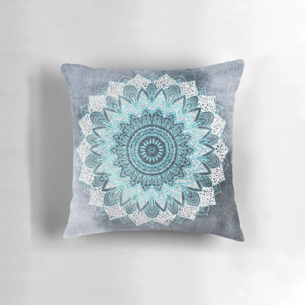 Bohemian-style mandala pattern printed on a blue and white pillow for home decor.