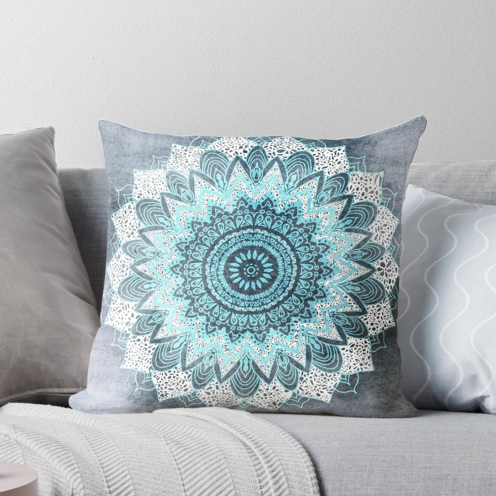 Bohemian-style mandala pattern printed on a blue and white pillow for home decor.