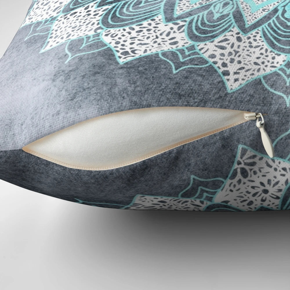 Bohemian-style mandala pattern printed on a blue and white pillow for home decor.