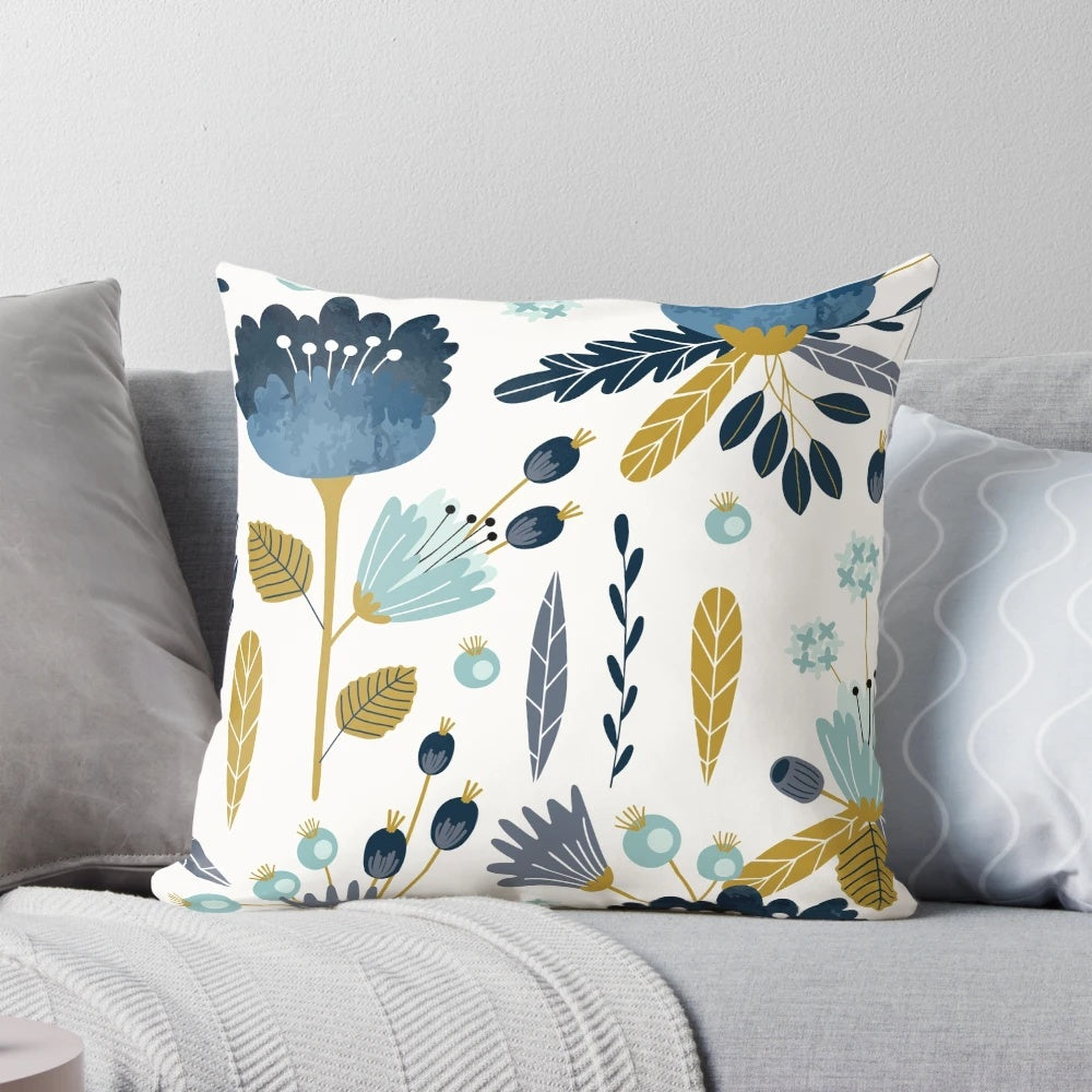 Colorful blue and yellow watercolor floral design on a decorative throw pillow
