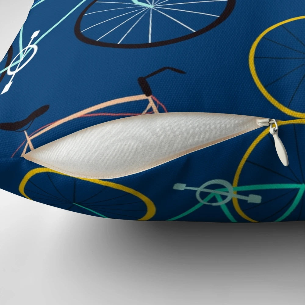 A colorful blue pillow featuring a bicycle design, perfect for cyclists and fitness enthusiasts.