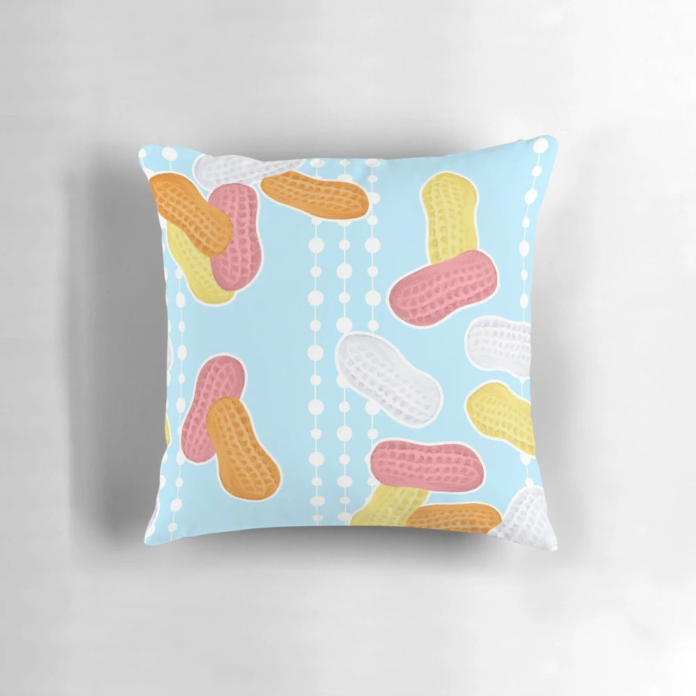 Blue circus peanut-themed pillow with a fun, dotted pattern