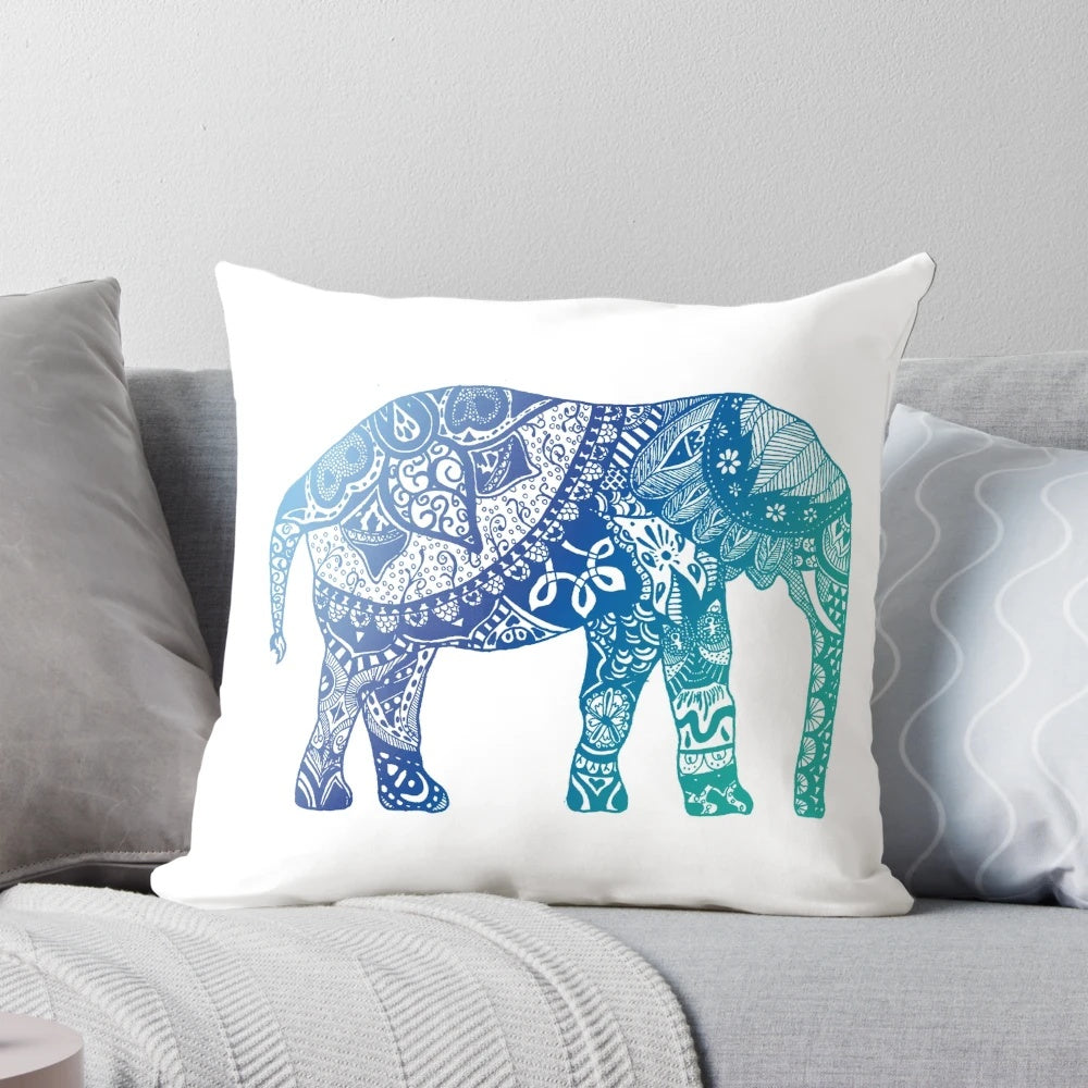 Blue elephant mandala design throw pillow with sun, moon, and earth imagery