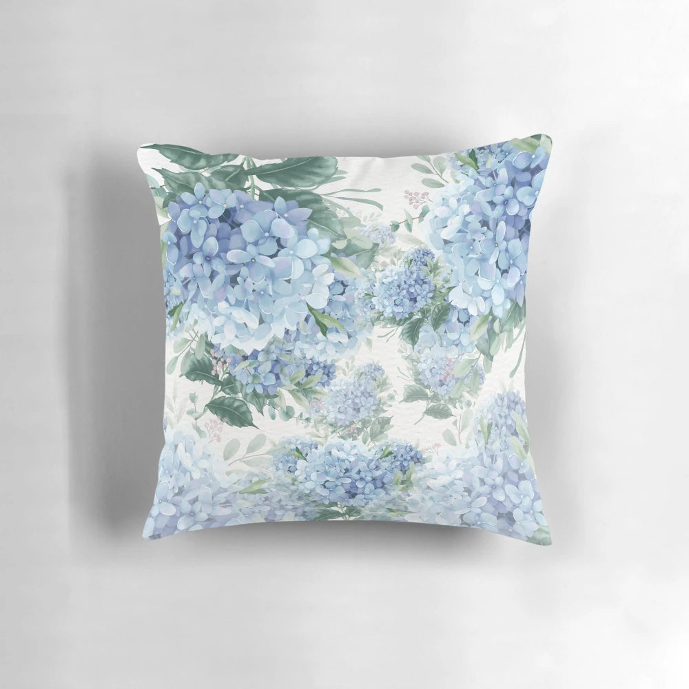 Closeup of vibrant blue hydrangea flowers on a throw pillow