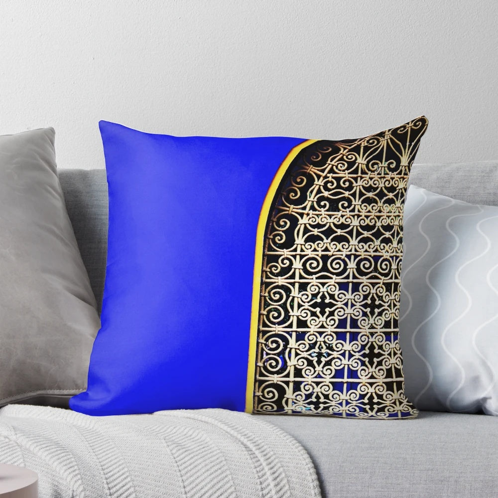 Closeup of a luxurious blue Majorelle pillow with a tropical, lush design