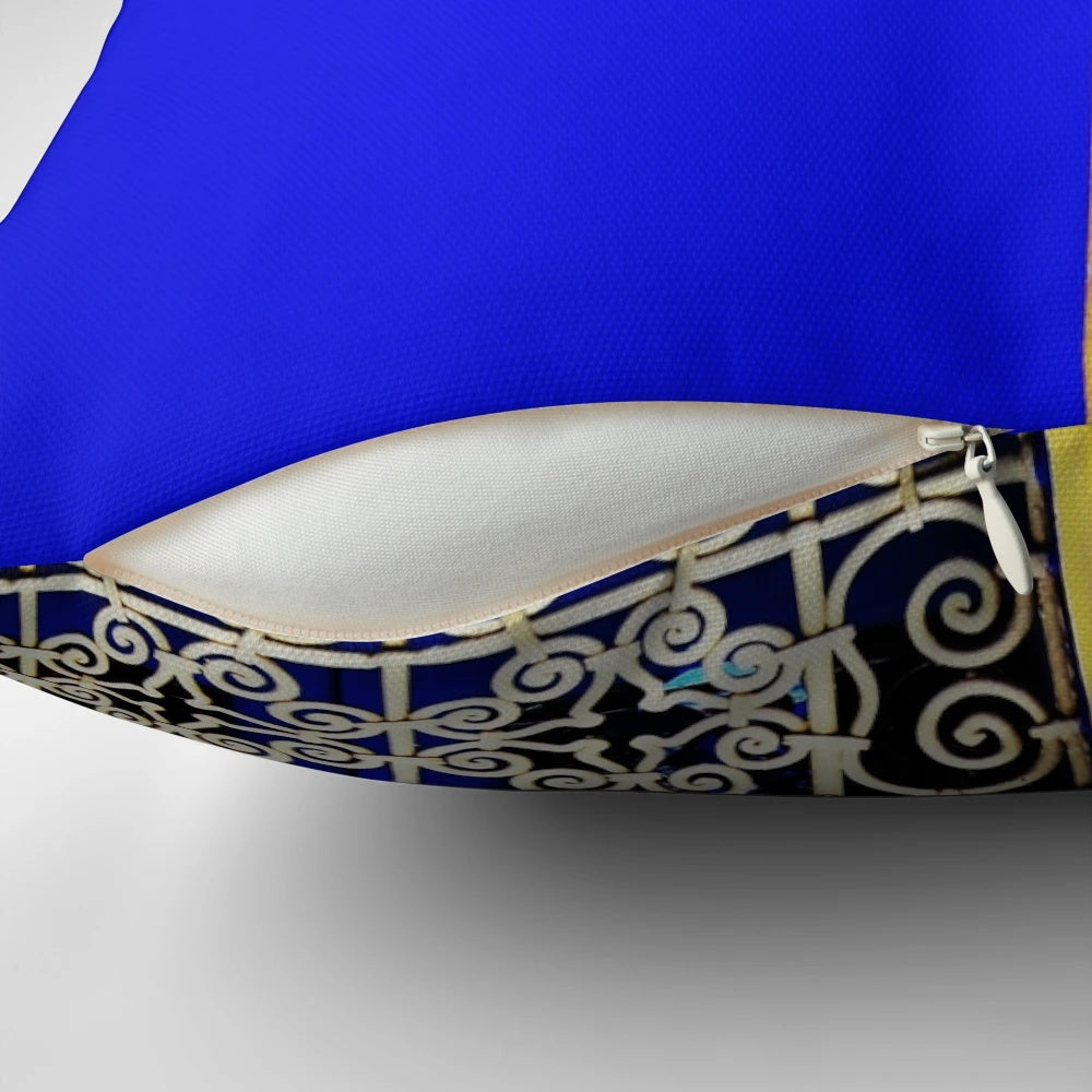 Closeup of a luxurious blue Majorelle pillow with a tropical, lush design
