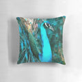 Vibrant blue peacock with fanned tail feathers printed on a soft, decorative throw pillow