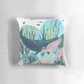 Decorative blue whale pillow with coral, tentacles, and ocean creatures for a whimsical nursery