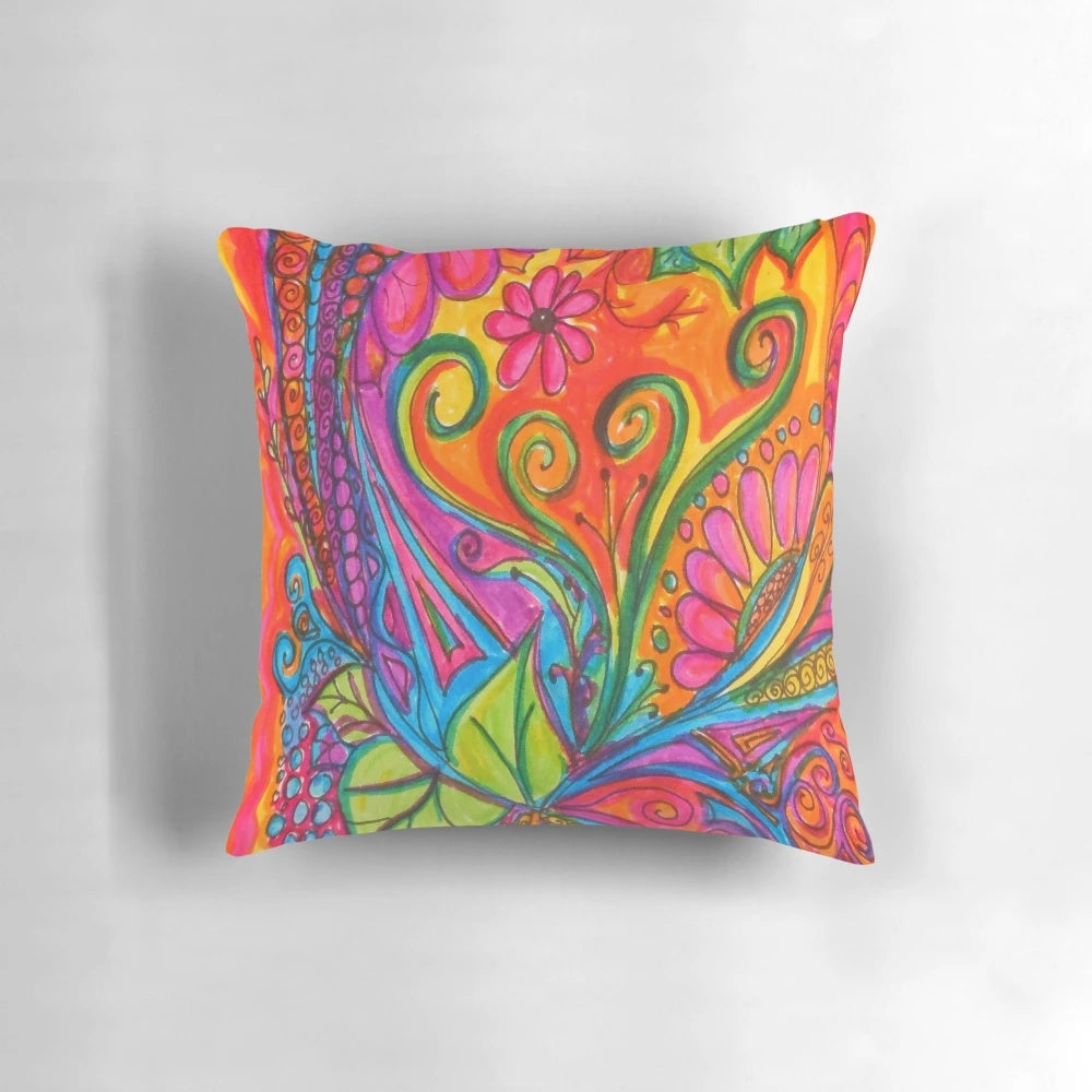 Colorful abstract art pillow with doodles, flowers, and hearts in a bohemian style