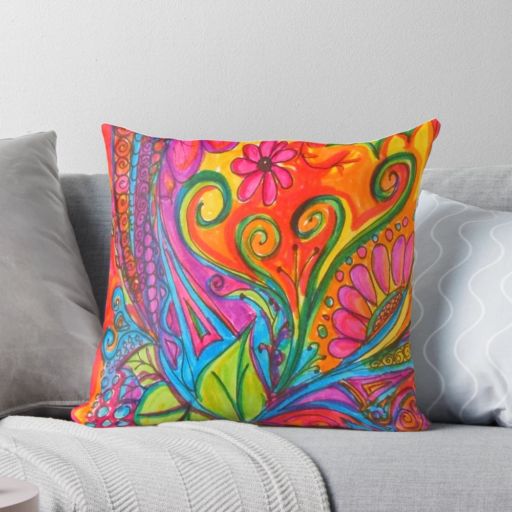 Colorful abstract art pillow with doodles, flowers, and hearts in a bohemian style