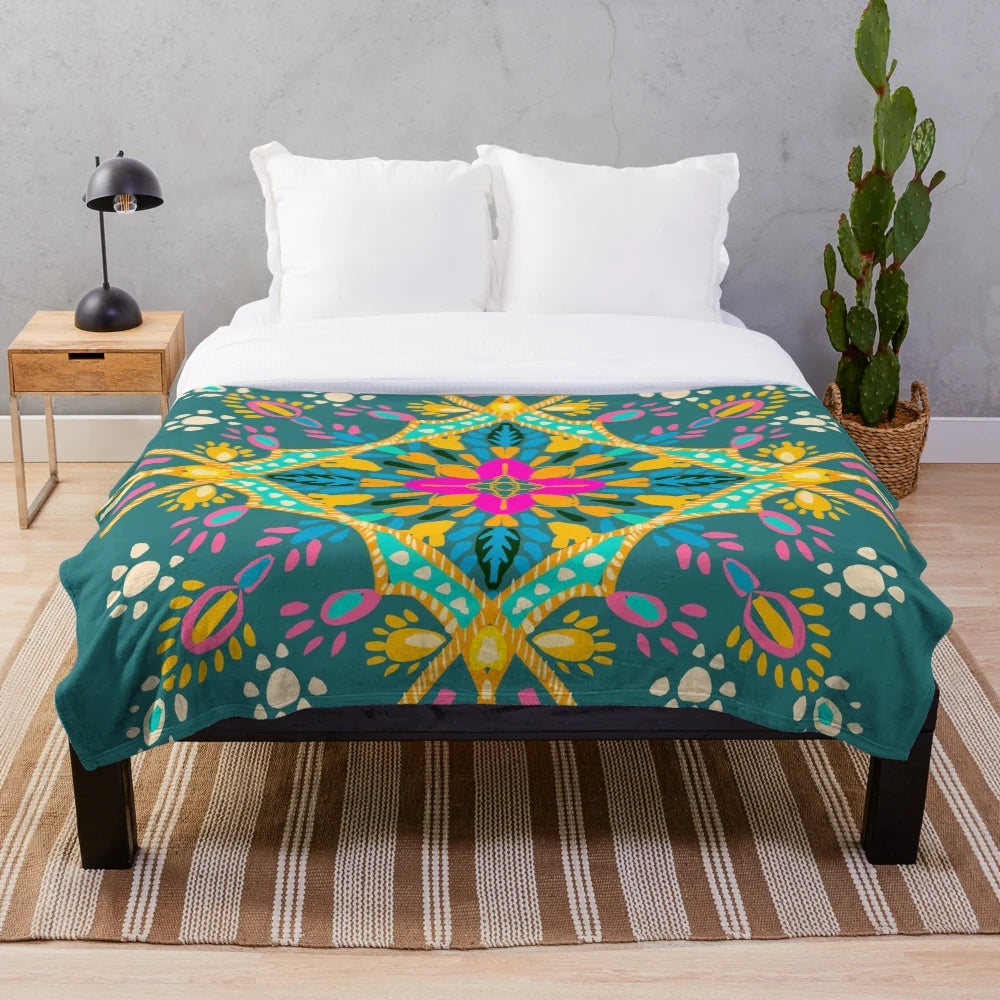 Bohemian-inspired plush blanket with colorful mandala and sacred geometry designs