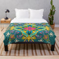 Bohemian-inspired plush blanket with colorful mandala and sacred geometry designs