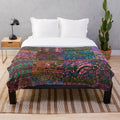 Vibrant, colorful bohemian plush blanket with a playful, hippie-inspired pattern