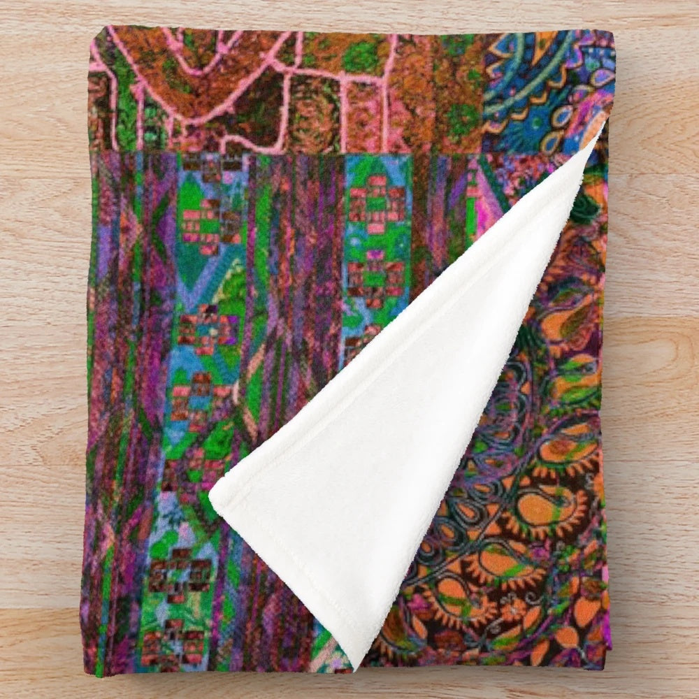 Vibrant, colorful bohemian plush blanket with a playful, hippie-inspired pattern