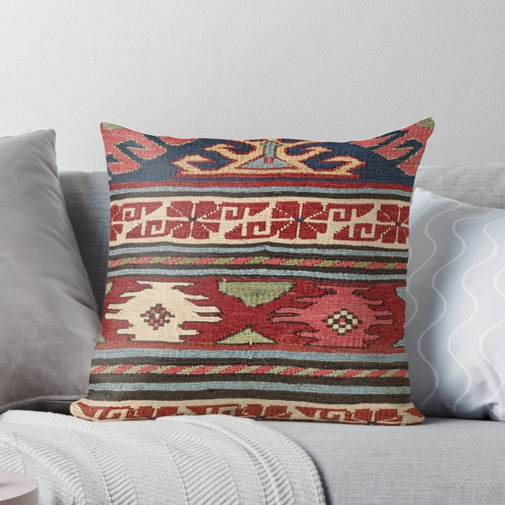 Colorful bohemian-inspired throw pillow with abstract Aztec pattern and retro sunburst design