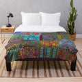 Vibrant bohemian plush blanket with rainbow patterns and textures