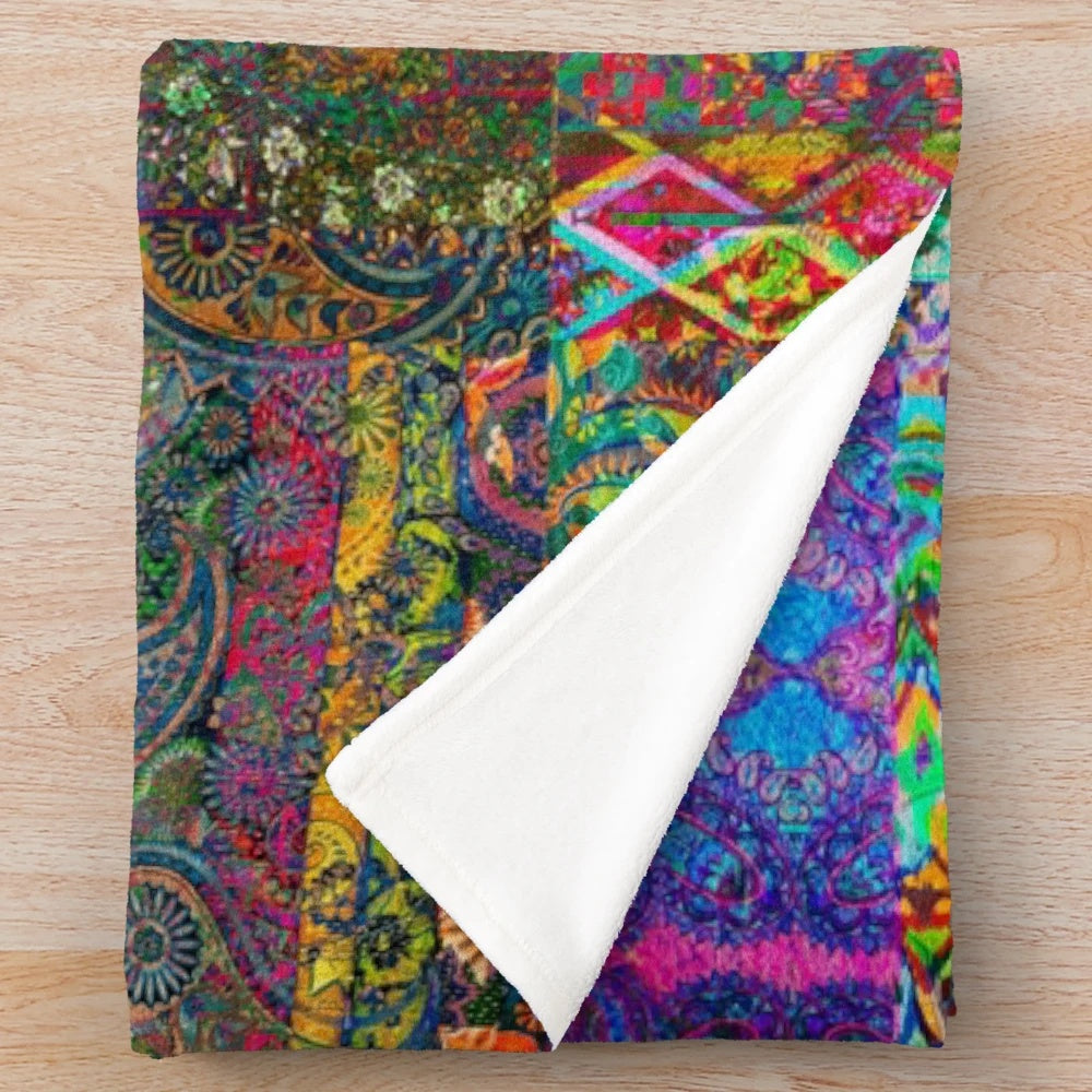 Vibrant bohemian plush blanket with rainbow patterns and textures