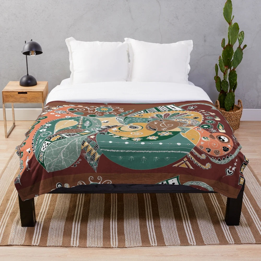 Plush blanket with vibrant boho-inspired abstract patterns and nature-inspired design