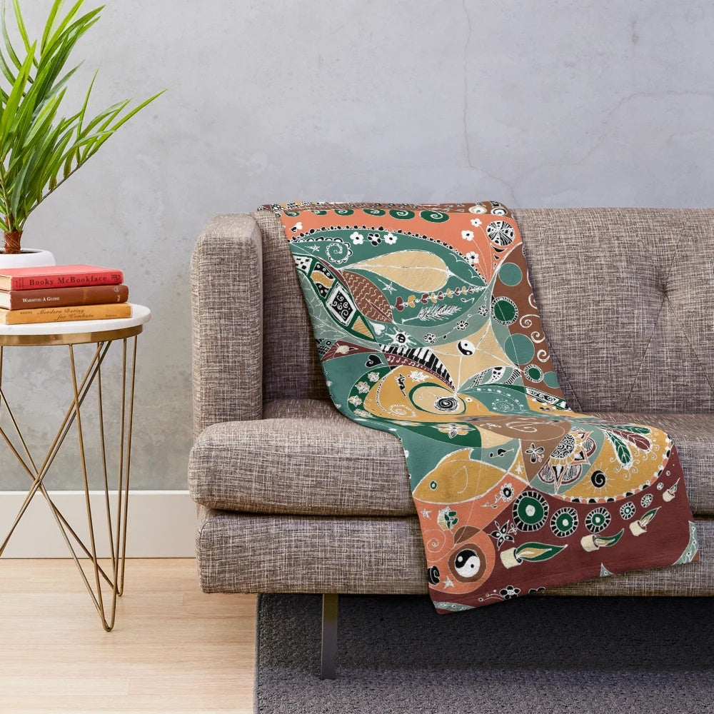 Plush blanket with vibrant boho-inspired abstract patterns and nature-inspired design