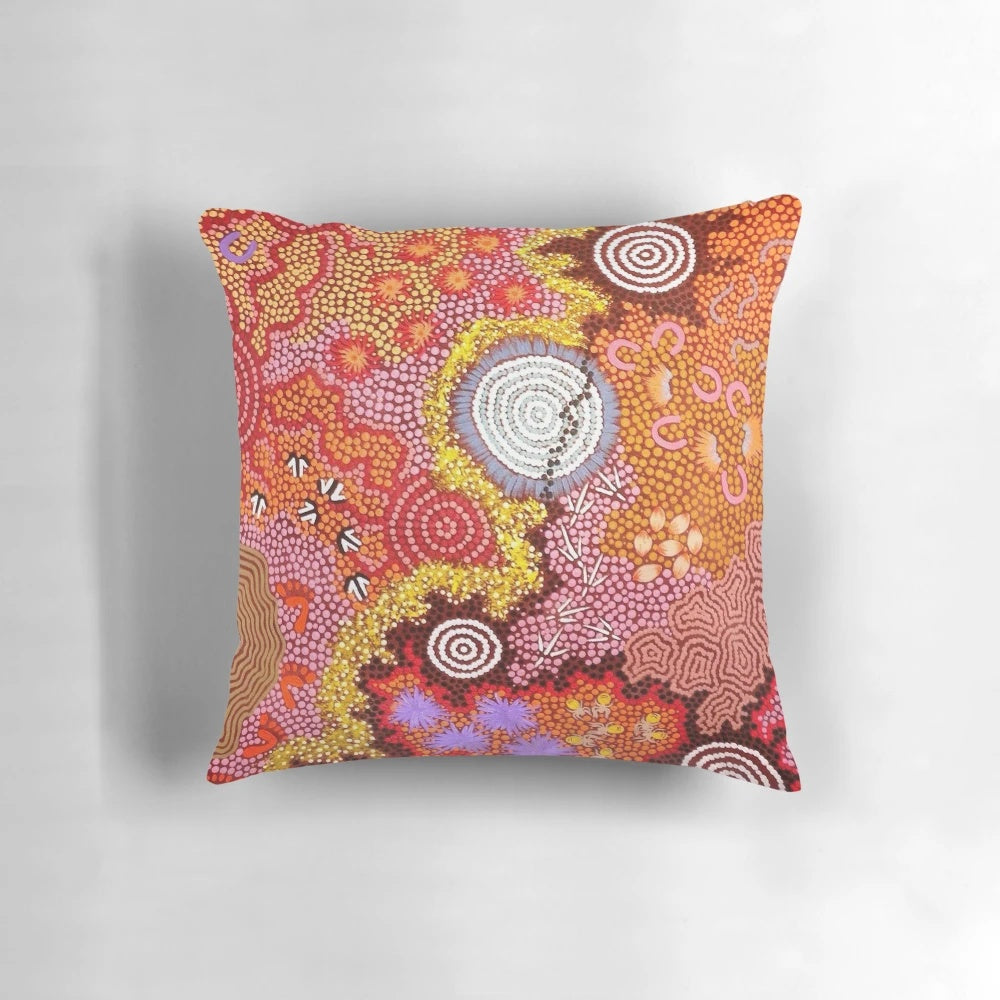 Pillow featuring a vibrant abstract design inspired by Australian aboriginal dot painting art