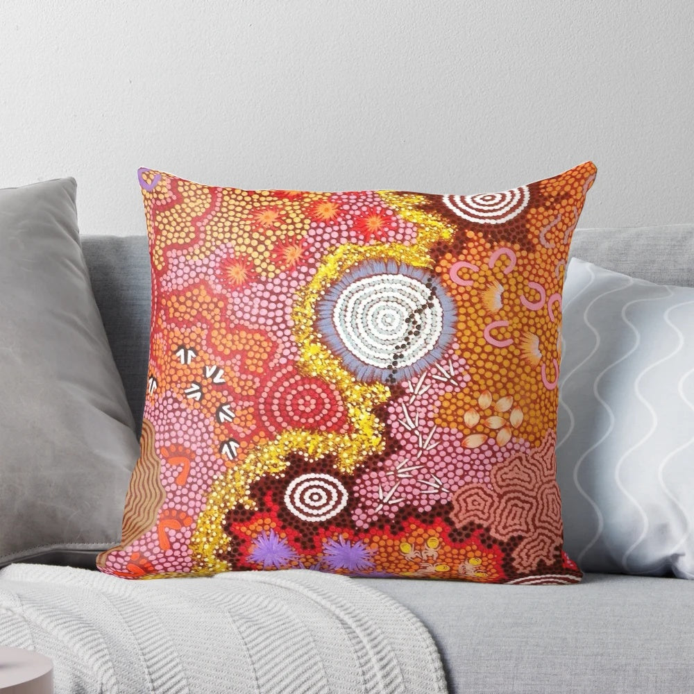 Pillow featuring a vibrant abstract design inspired by Australian aboriginal dot painting art