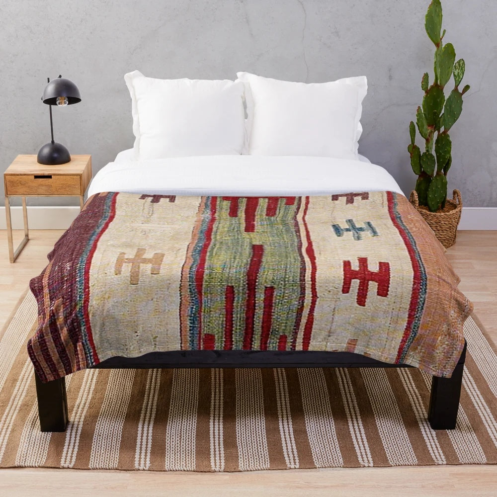Colorful boho-inspired plush blanket with abstract, southwestern-style pattern