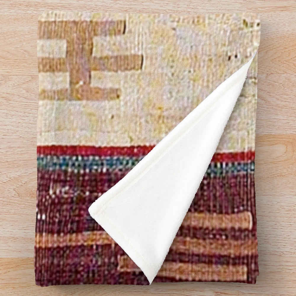 Colorful boho-inspired plush blanket with abstract, southwestern-style pattern