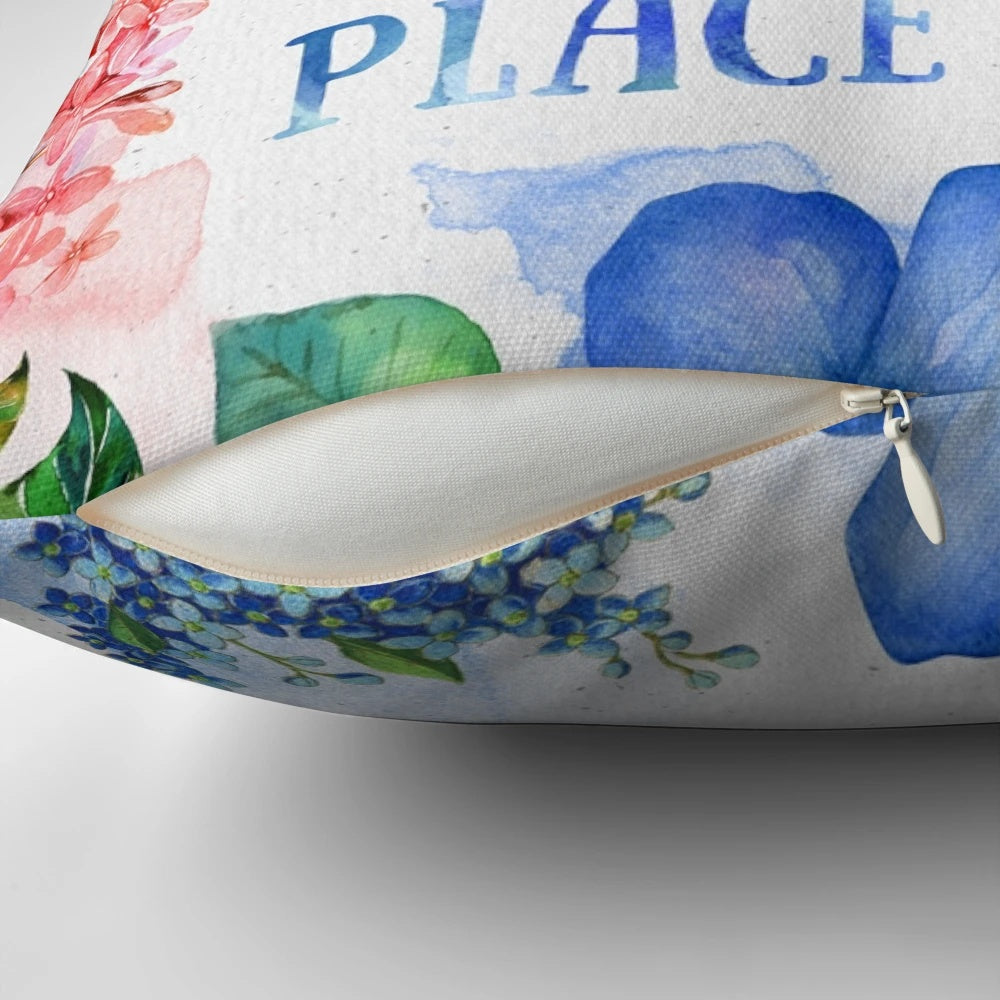 A vibrant, watercolor-inspired throw pillow featuring colorful flowers, leaves, and a bookish design for book lovers.