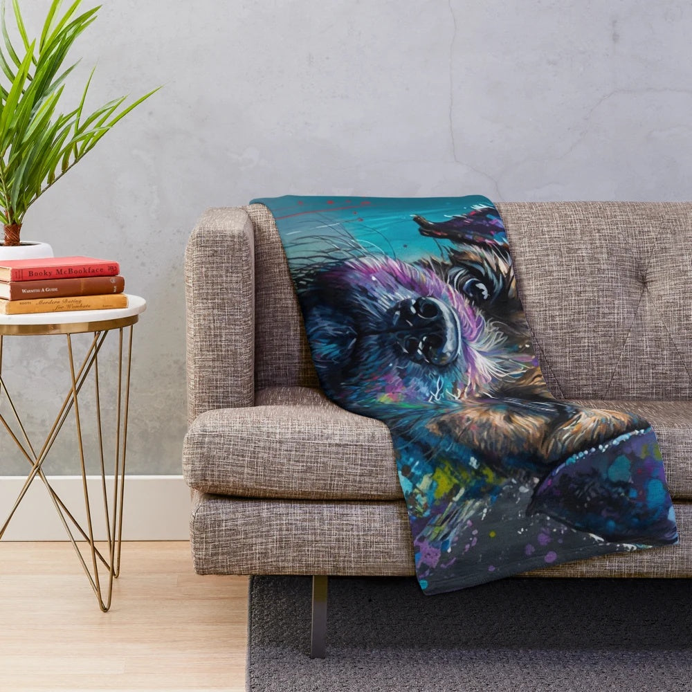 Colorful plush blanket featuring a border terrier dog in a synesthetic splash art style