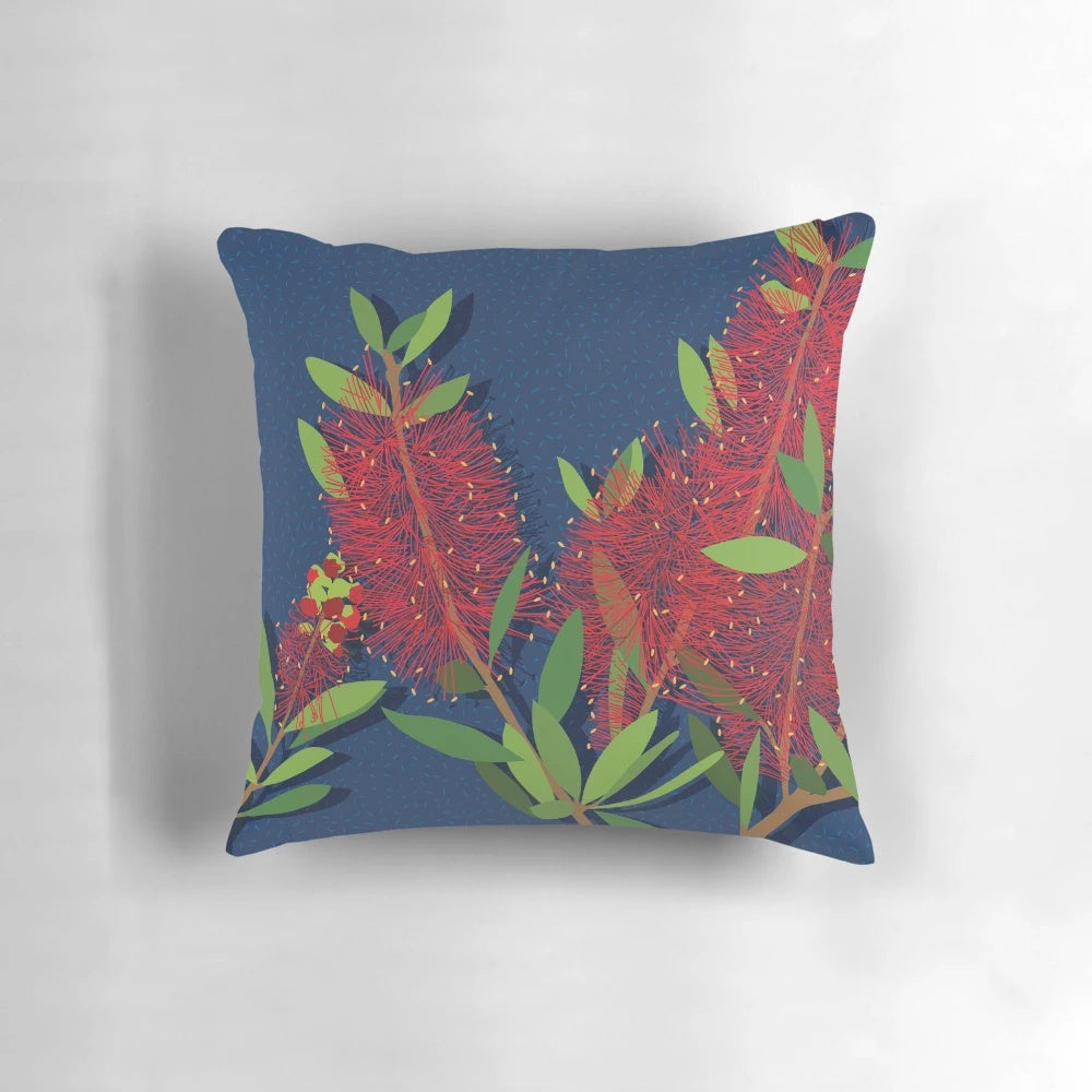 Pillow featuring a close-up image of the vibrant red bottlebrush flowers, a native Australian plant.