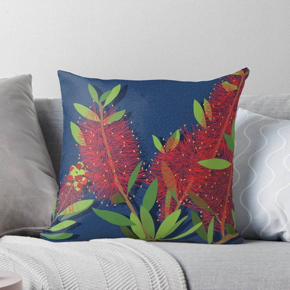 Pillow featuring a close-up image of the vibrant red bottlebrush flowers, a native Australian plant.